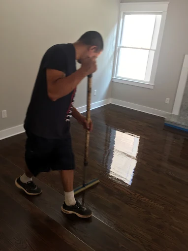 Applying polyurethane finish coat to dark-stained hardwood